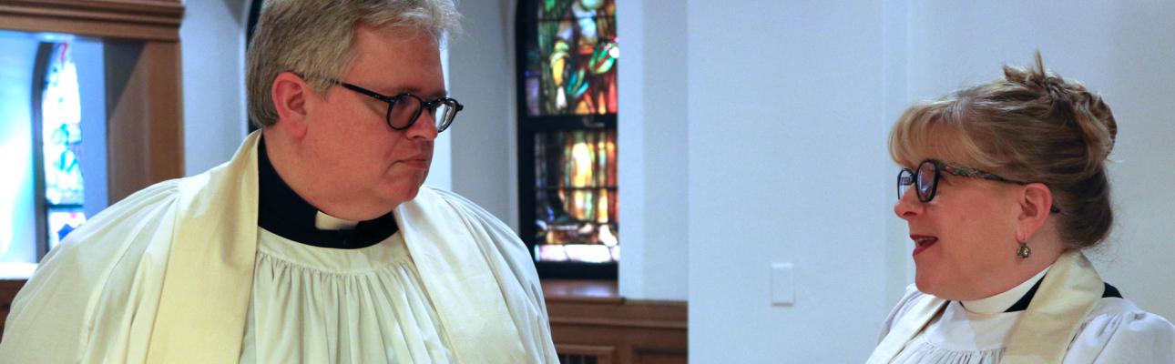 Canon Wright and Canon Clark chat after a recent ordination service. NINA NICHOLSON PHOTO