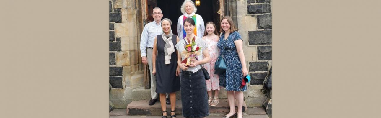 Christina (front) with her family and rector following the renaming liturgy.