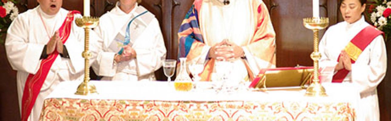 Bishop Beckwith with three new transitional deacons.