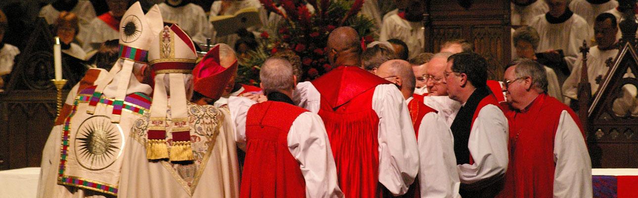 Bishops lay hands on the Rt. Rev. Mark Beckwith, 10th Bishop of Newark, at his consecration in January 2007. NINA NICHOLSON PHOTO