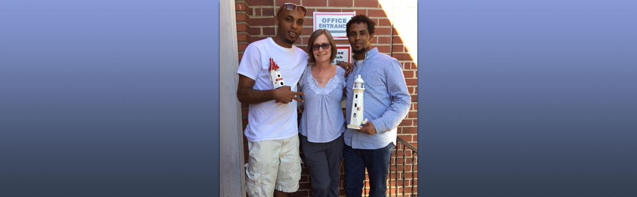 Jill Singleton with two guests at The Lighthouse, which she helped establish to provide temporary housing and resettlement for asylum seekers after released from detention.