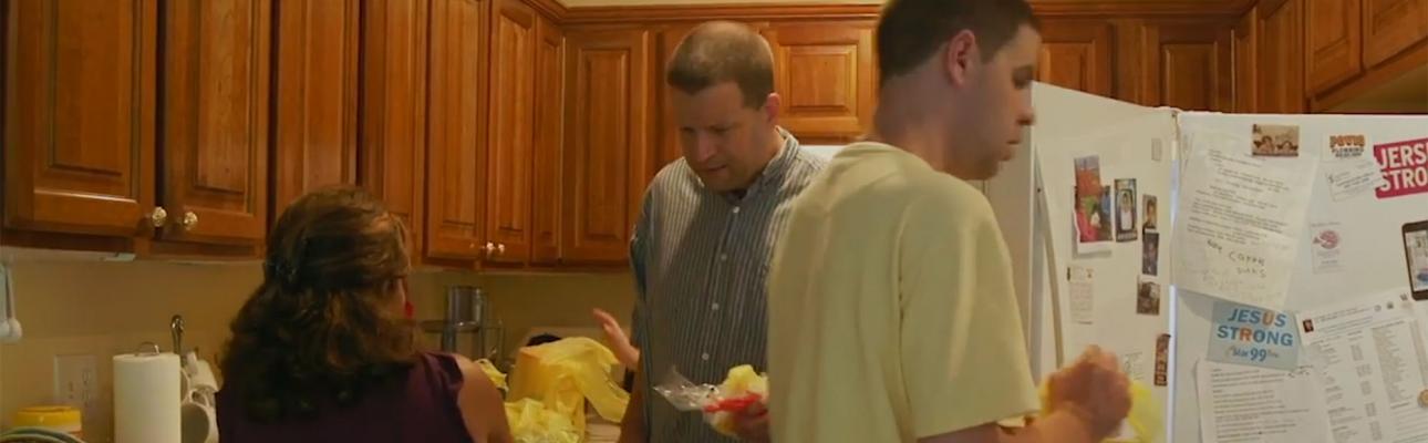 Matt and Dan, two autistic young men who are roommates, put away groceries with Carmen, who provides care giving oversight. PHOTO COURTESY SUPPORTIVE HOUSING ASSOCIATION OF NJ