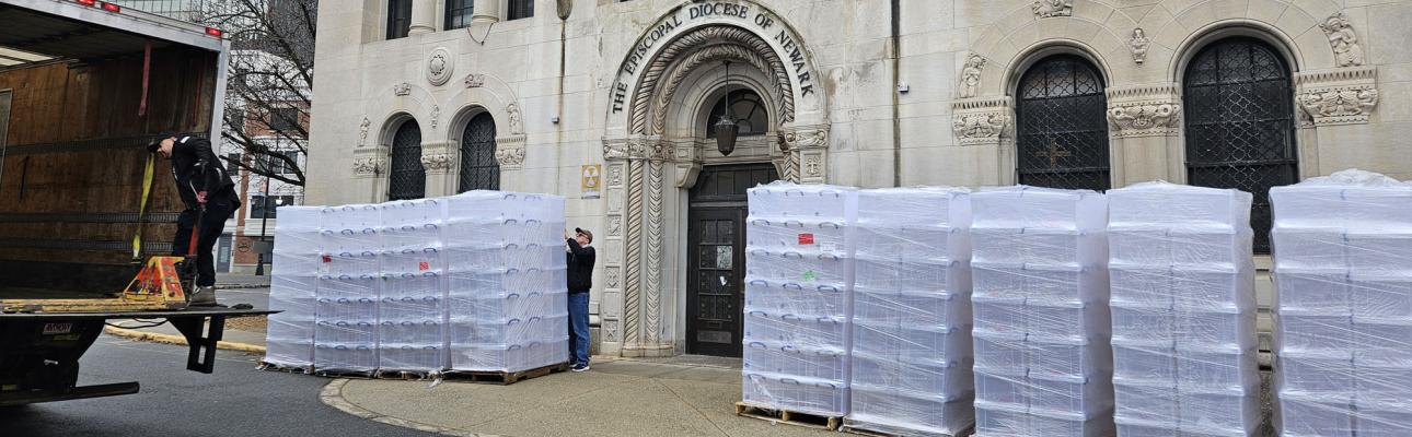 John King inspects empty packing bins being delivered to Episcopal House in preparation for the move to a new headquarters later this year. JANE JUBILEE PHOTO