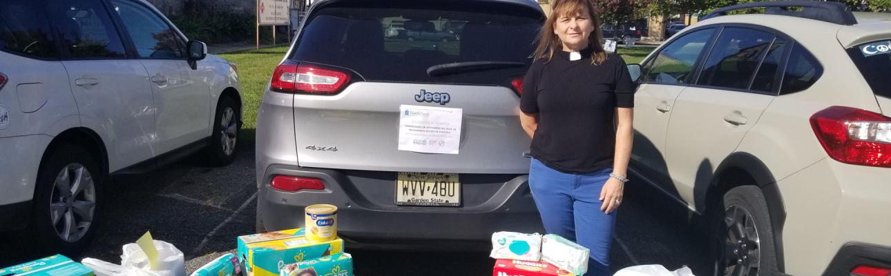 The Rev. Ellen Kohn-Perry, president of North Porch, with donations at their Dover location.