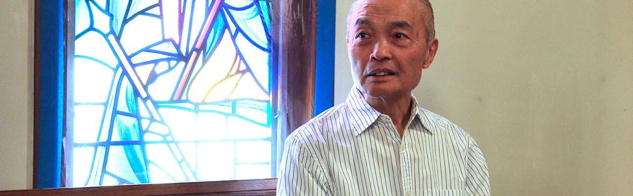 Gary Eng pauses for a moment of reflection in the nave of St. Paul's, North Arlington. NINA NICHOLSON PHOTO