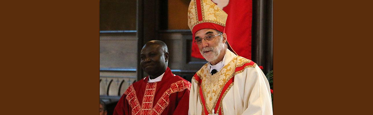 The Rev. Sylvester Ekunwe with Bishop Mark Beckwith at his ordination on June 17, 2017.