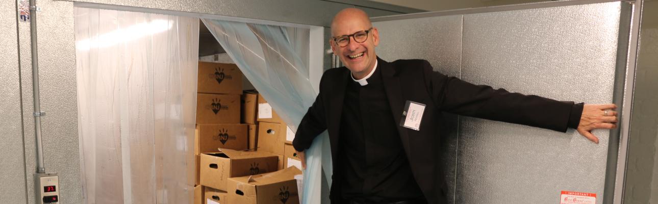 The Rev. John Mennell of St. Luke's, Montclair shows off the new walk-in refrigerator, part of the $1.2 million renovation of the church's undercroft to expand the ministry of Toni's Kitchen. NINA NICHOLSON PHOTO