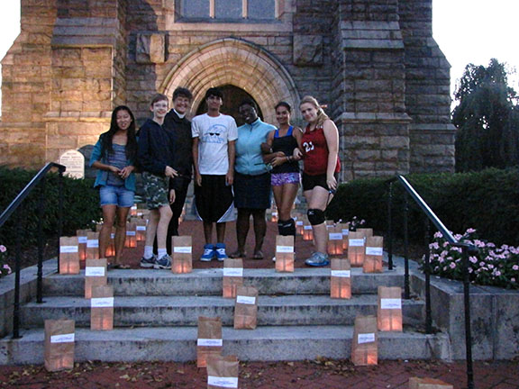 The Rev. Melissa Hall and St. Peter's youth with luminaries